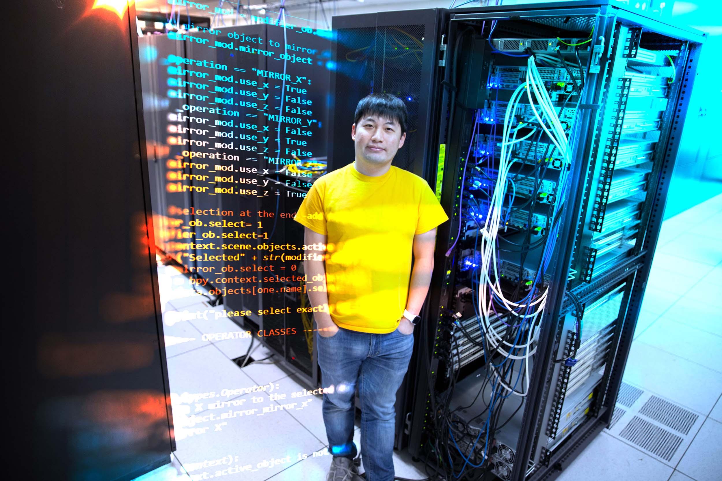 Artistic portrait of Ruoyu "Fish" Wang stading near a server rack with lines of programming code superimposed on the left